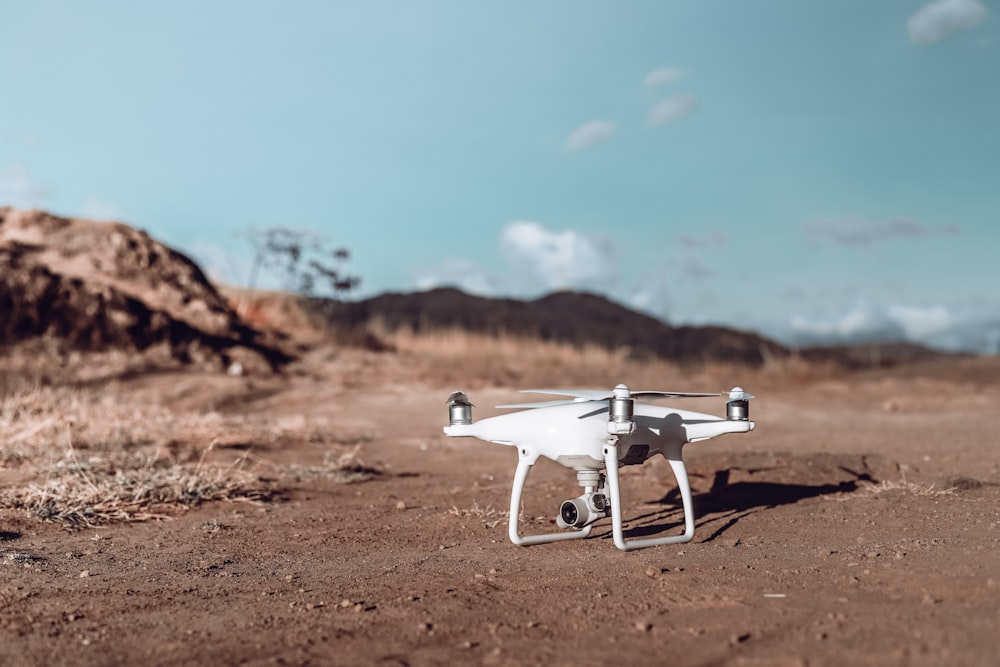 white drone on brown soil