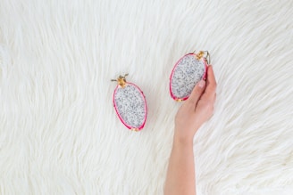 two oval white-and-pink cases