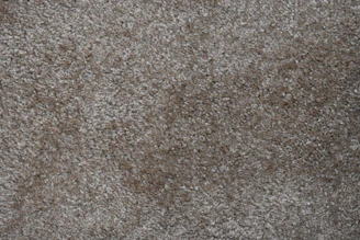 Close up of brown area carpet with a stain