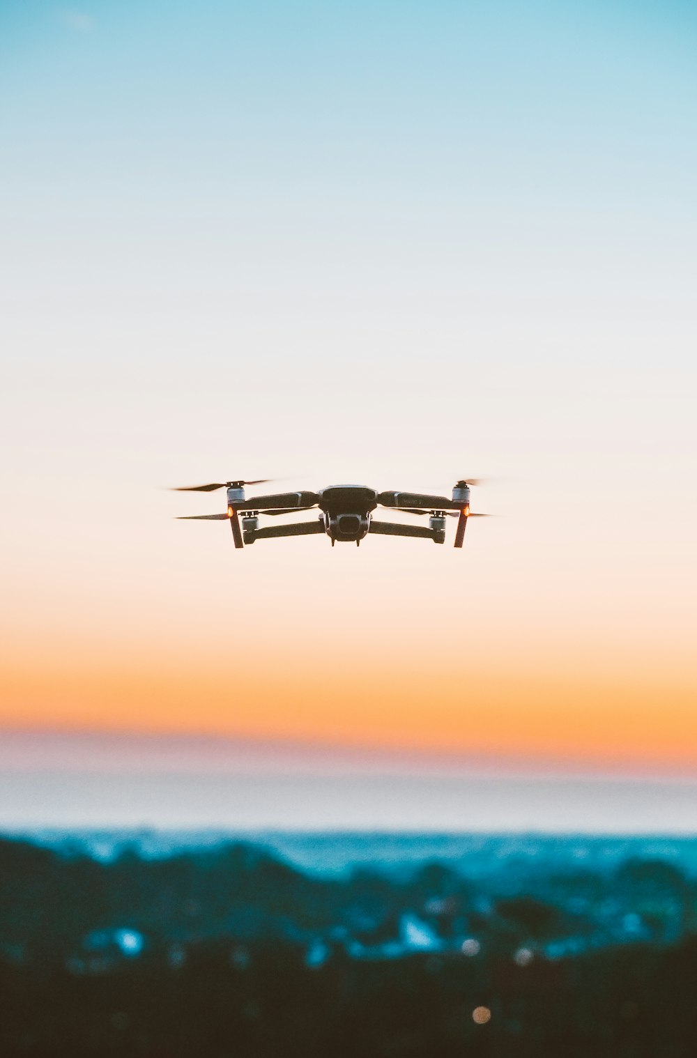 white camera drone during daytime