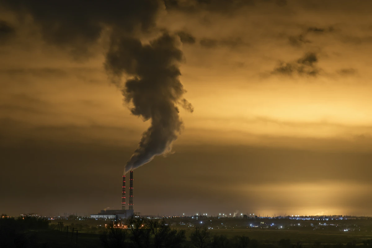 Smoke rising from an industrial factory chimney