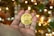 Close-up of hands holding a glowing digital globe symbolizing blockchain technology.