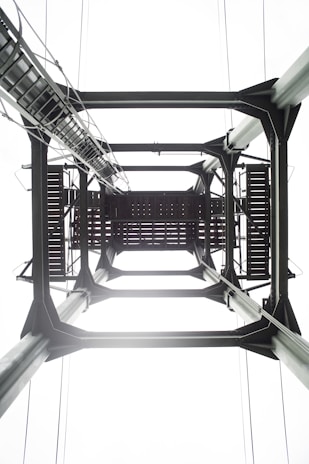 Close-up of a sturdy metal framework installed by Crasmetal under a clear blue sky.