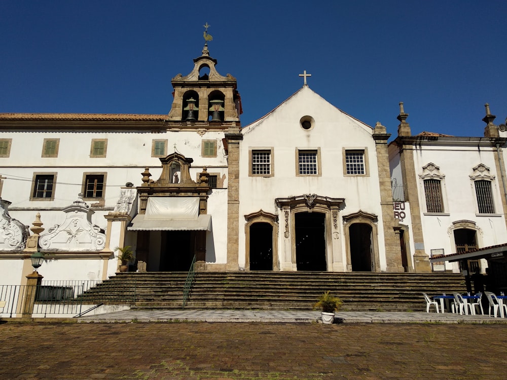 white and brown painted building under blue sky