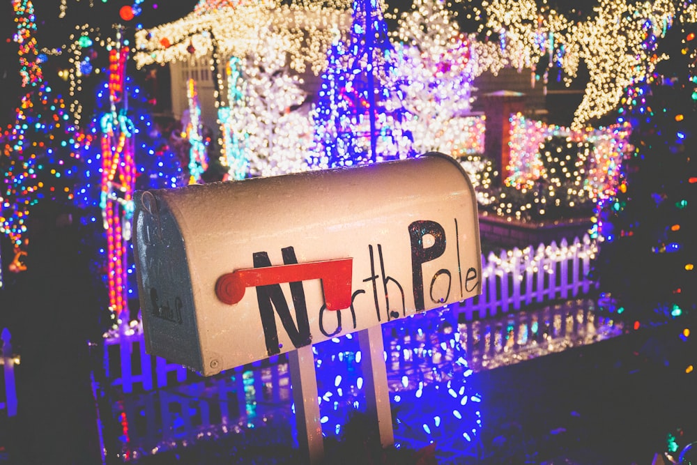 close-up photo of mailbox near string lights