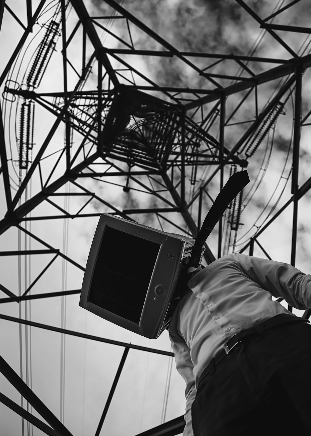 man wears computer monitor headdress in tower