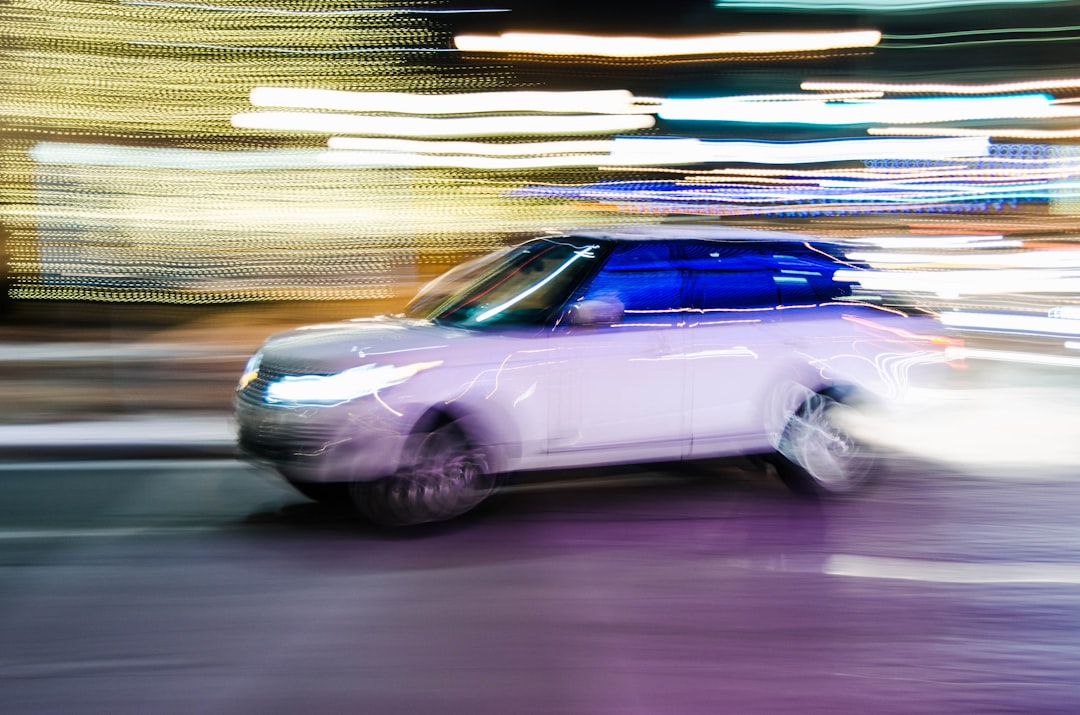 time lapse photography of vehicle on road