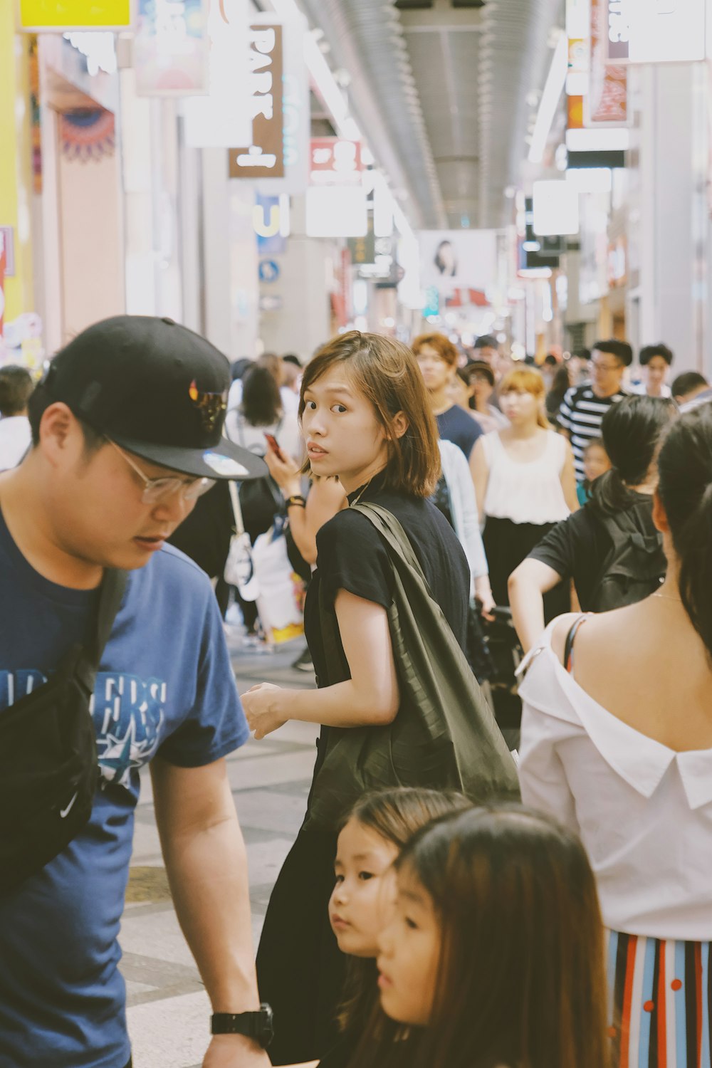 man standing in front of two girls