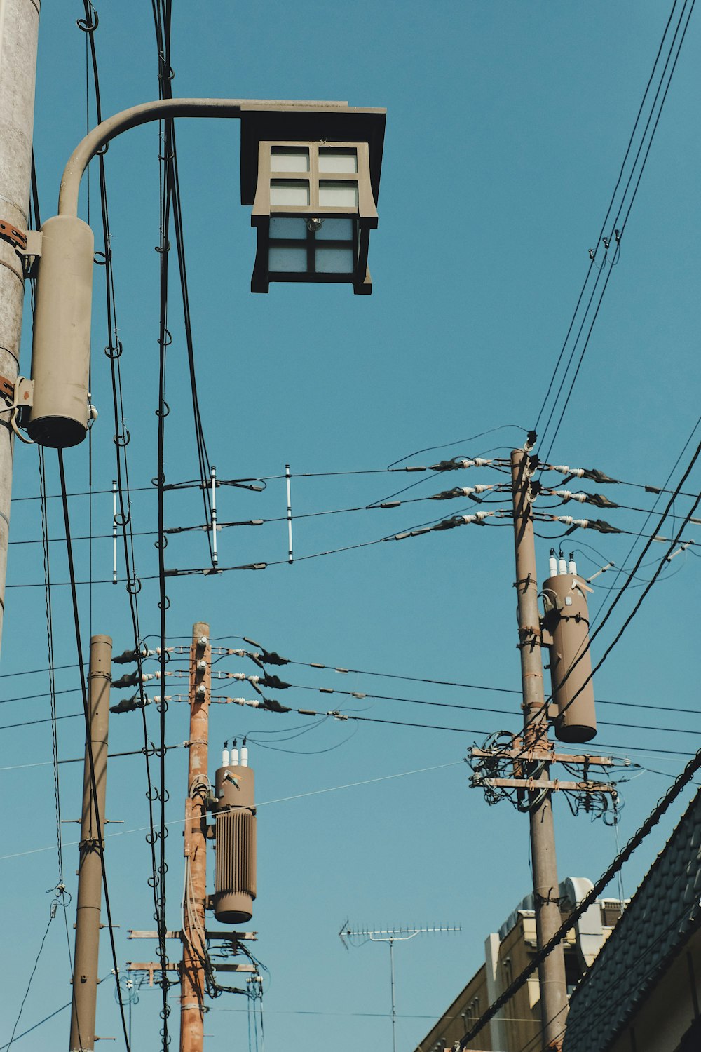 gray concrete electric posts during daytime