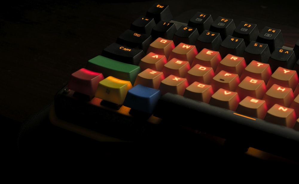 orange, black, and green mechanical keyboard