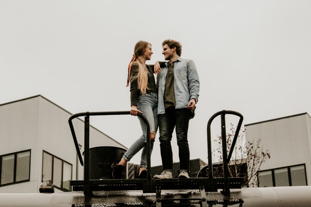 woman and man standing while facing each other