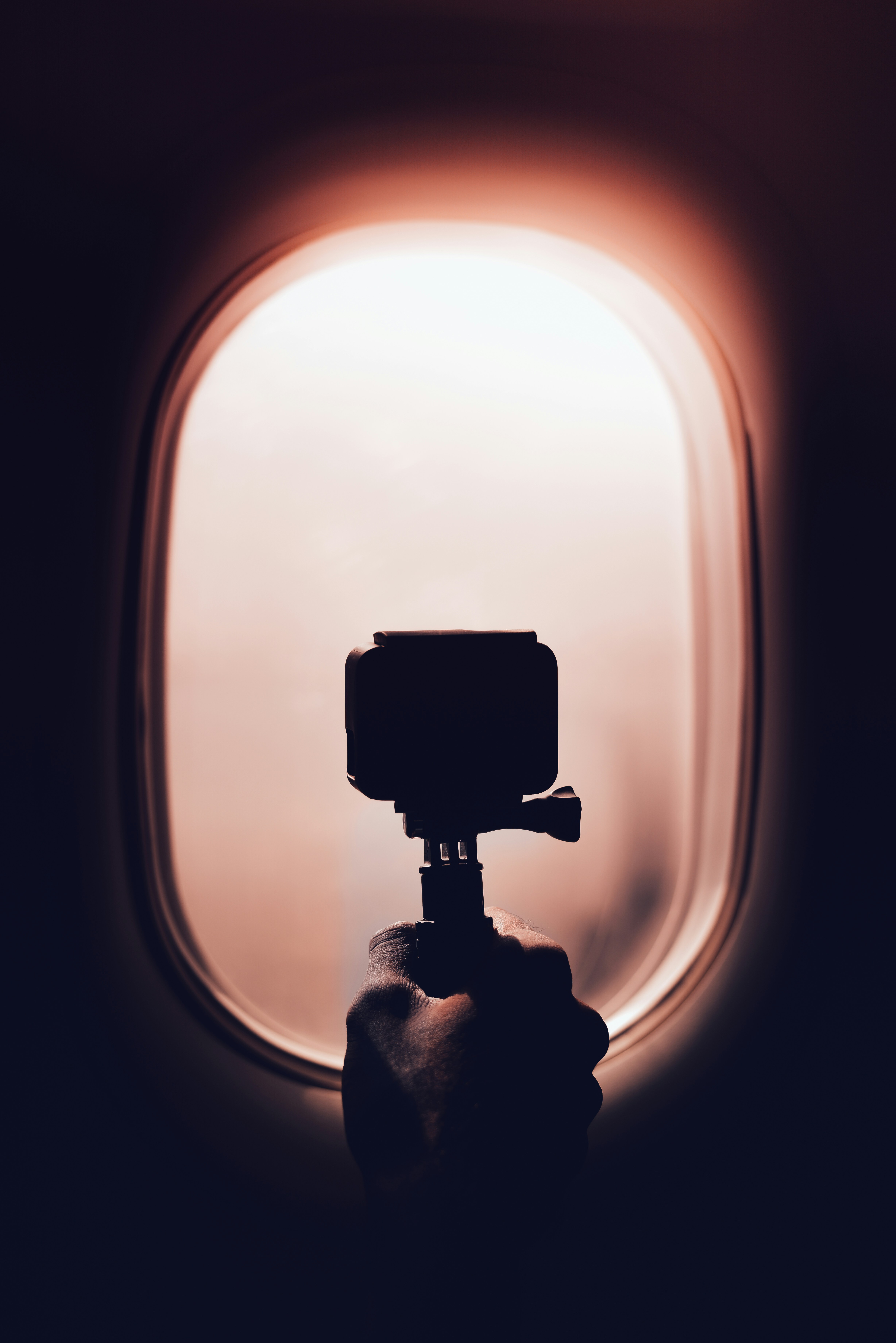 person holding action camera