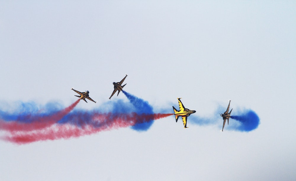 four jet planes on sky