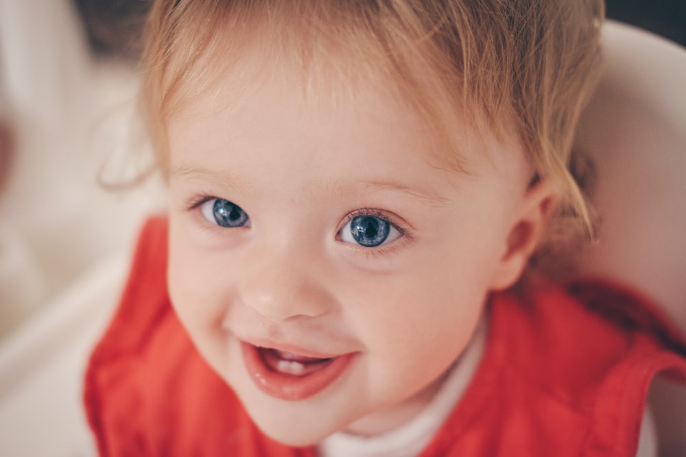 toddler smiling while looking up