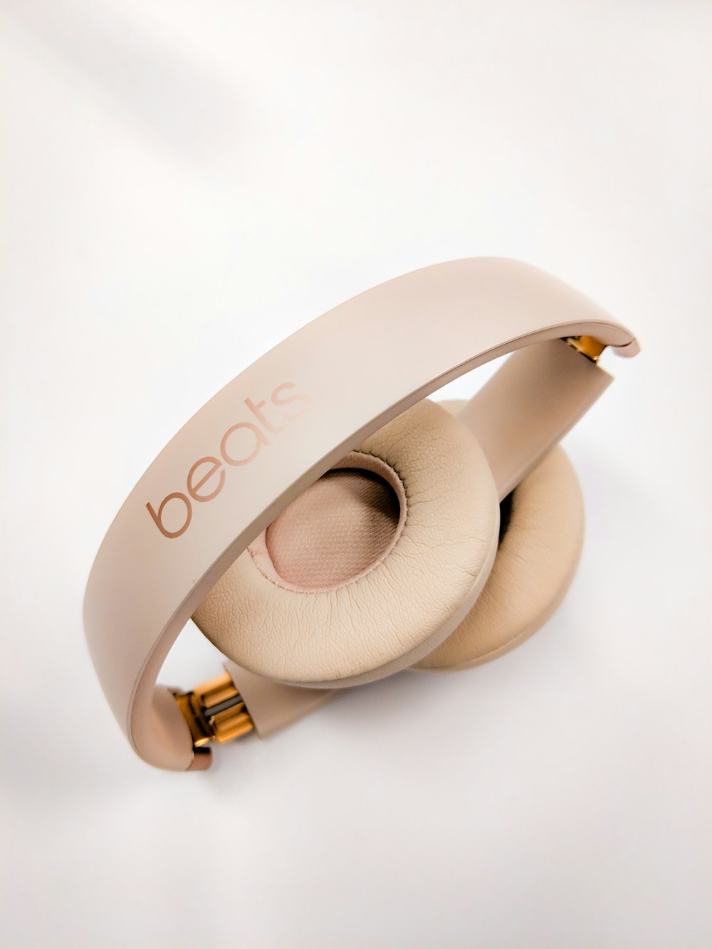 gold Beats wireless headphones