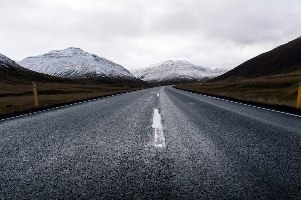 asphalt road with mountain background