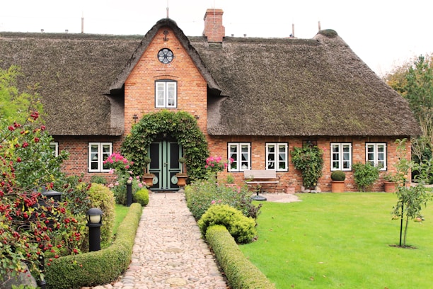 A charming two-bedroom townhouse with a small garden in a quiet UK neighborhood.