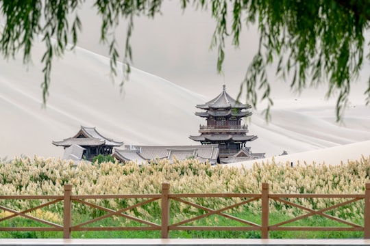 gray pagoda painting in Mingsha Mountain and Crescent Moon Spring China