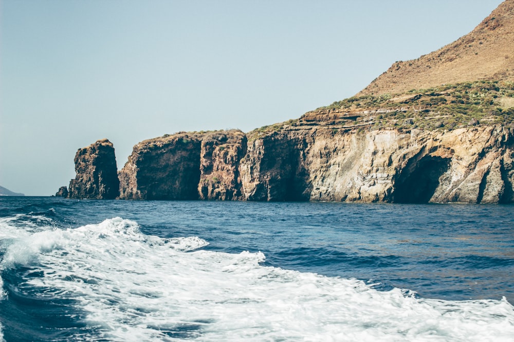 landscape photography of body of water and mountain