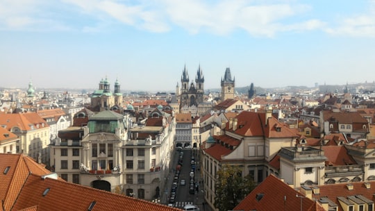 vehicles near buildings during day in Old Town Square Czech Republic