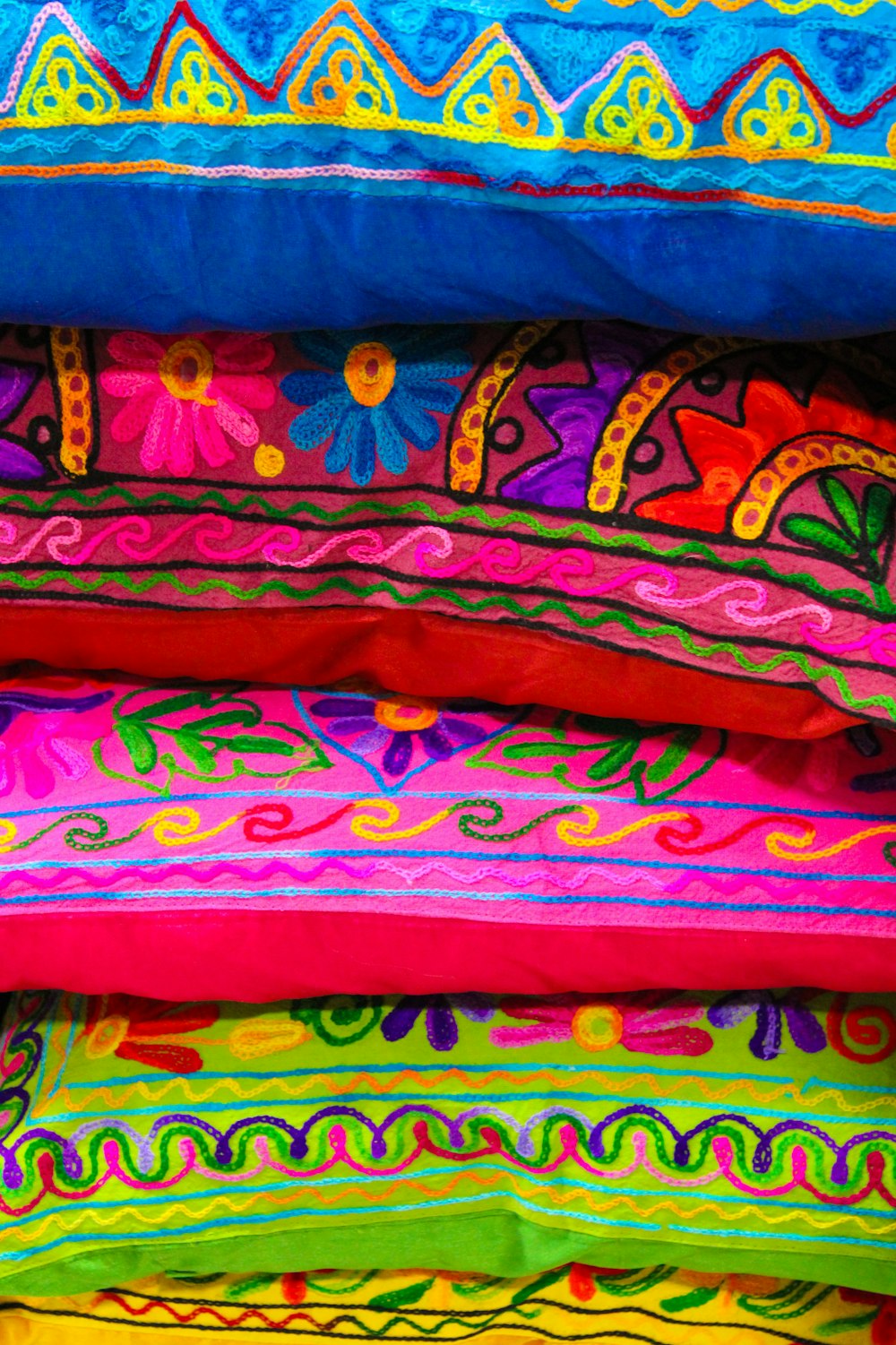 stack of multicolored pillows
