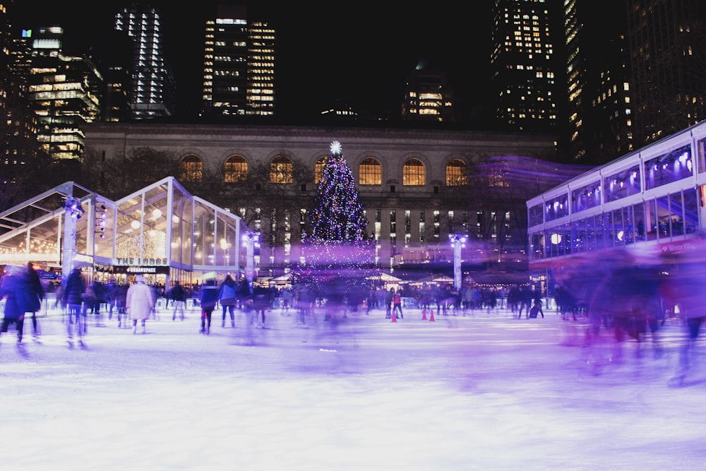 crowd on ice rink during night