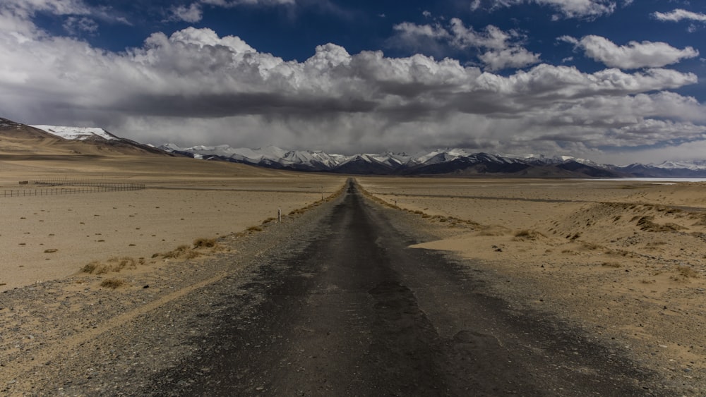 road under the blue cloudy sky