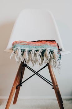 teal knit scarf on chair