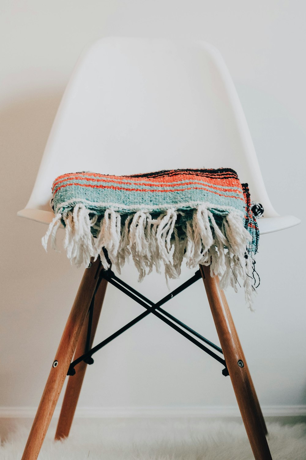 teal knit scarf on chair