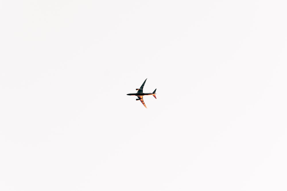 black and gray airplane on sky