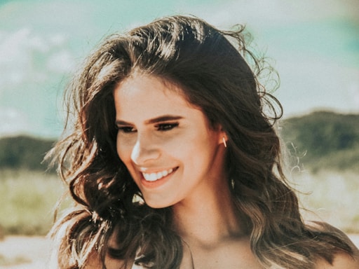 Portrait of Mirjam Walter smiling warmly with a natural background.