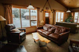 Cozy living room with plush sofas and warm wooden accents.