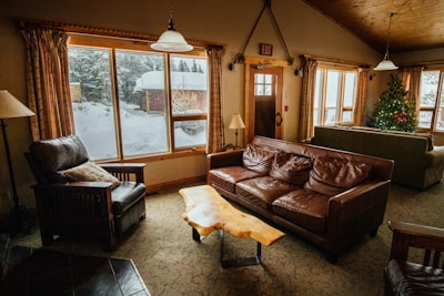 Photo of a cozy living room set up to welcome guests after a day outdoors.