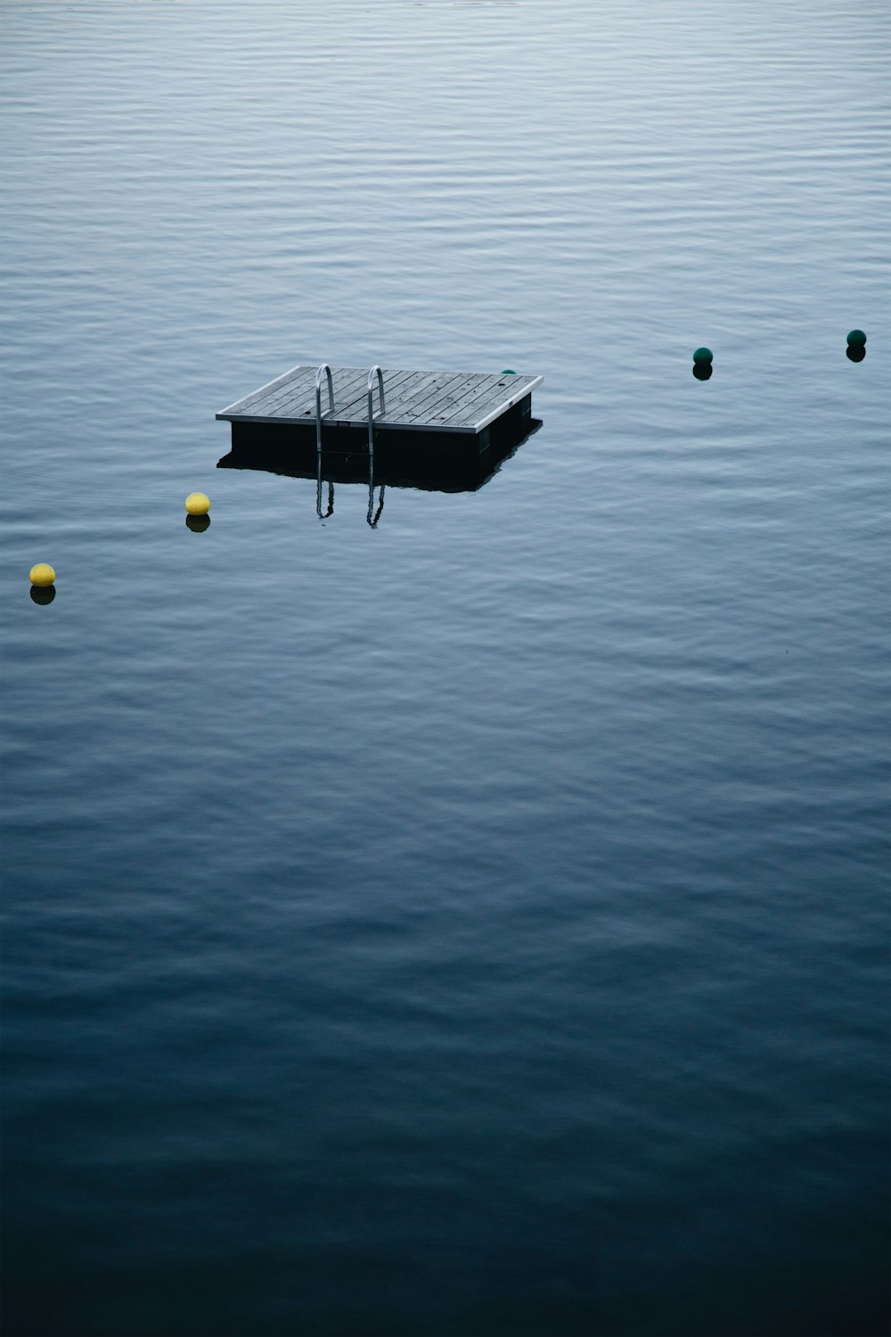 brown floating board on body of water