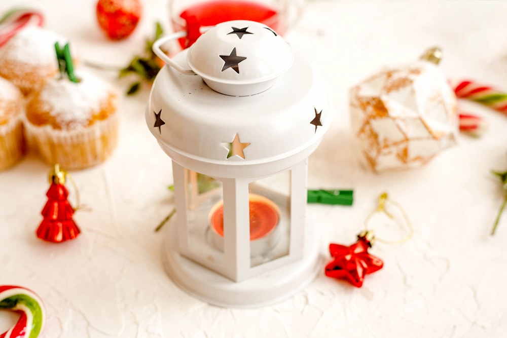 white and gray candle lantern