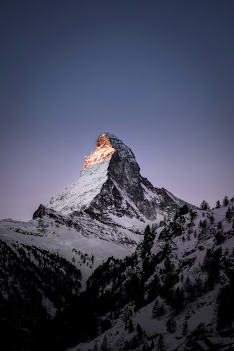 The pyramidal peak of the Matterhorn rising above the Alps near Zermatt