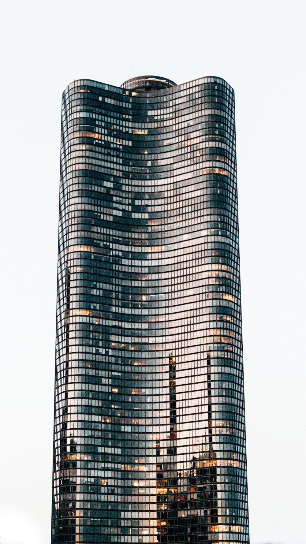 low angle photo of curtain glass wall building