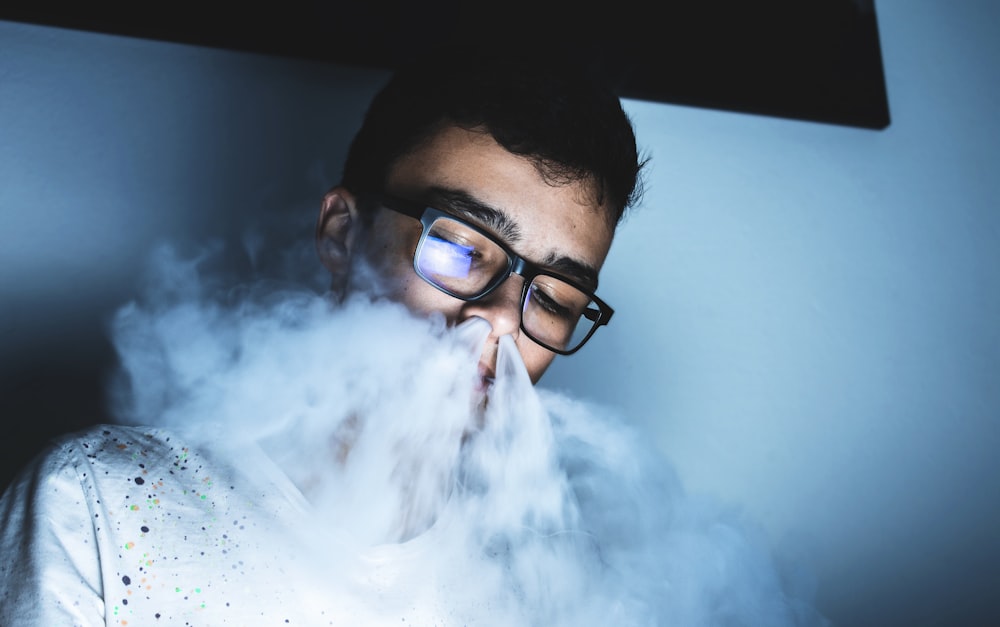 man wearing black framed eyeglasses