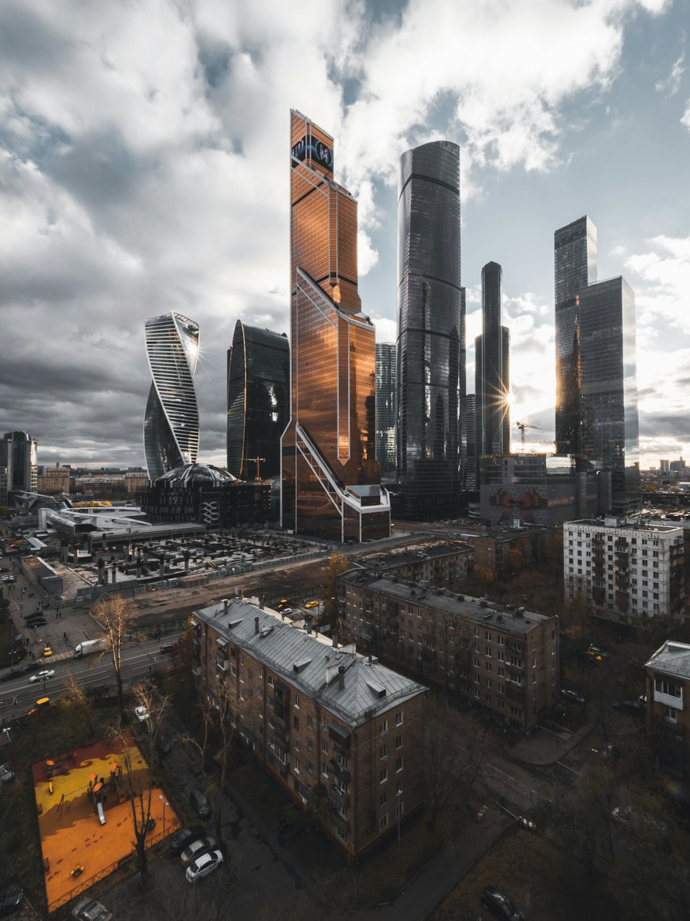 selective color photography of curtain wall highrise building during daytime