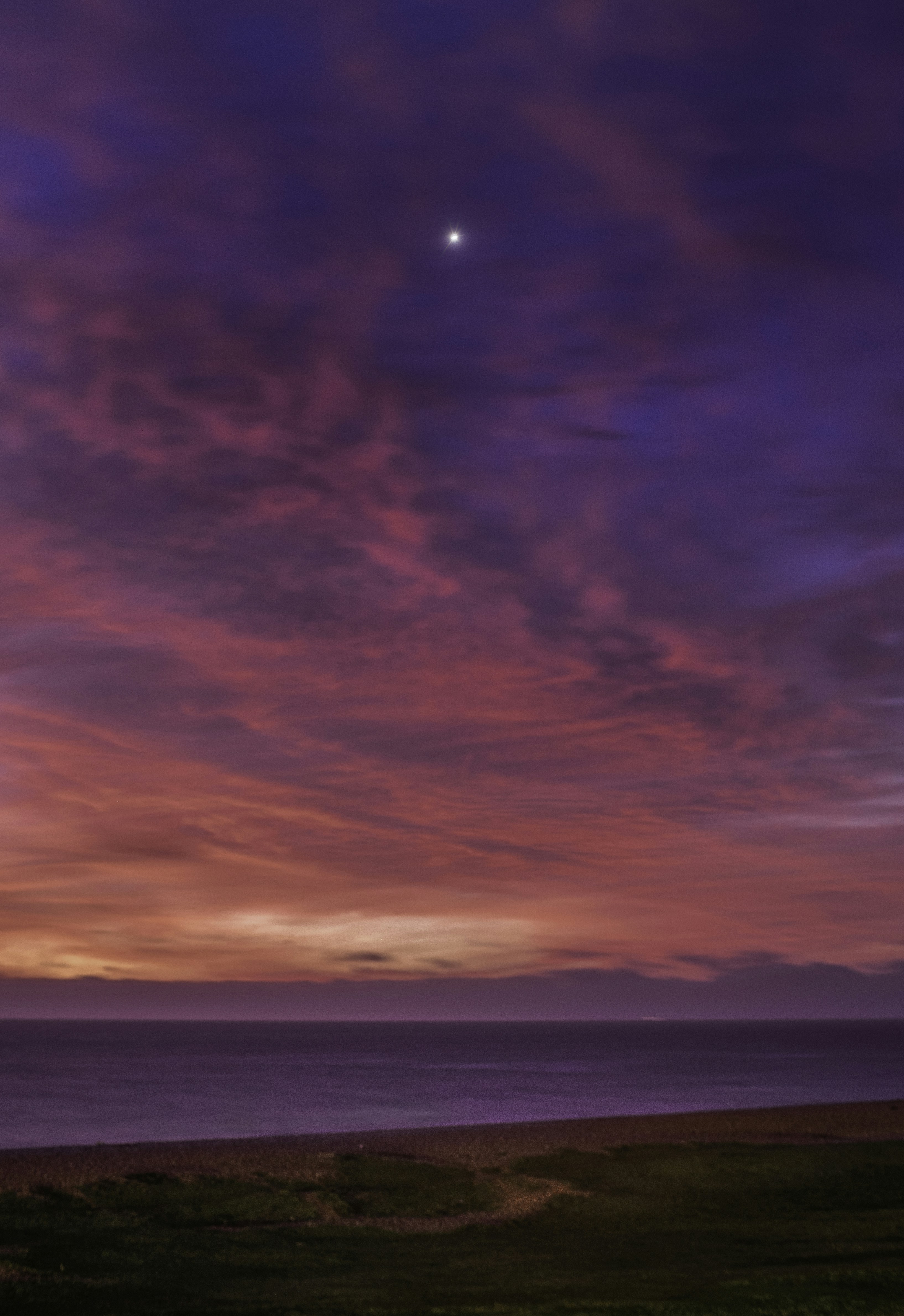 ocean under cloudy sky