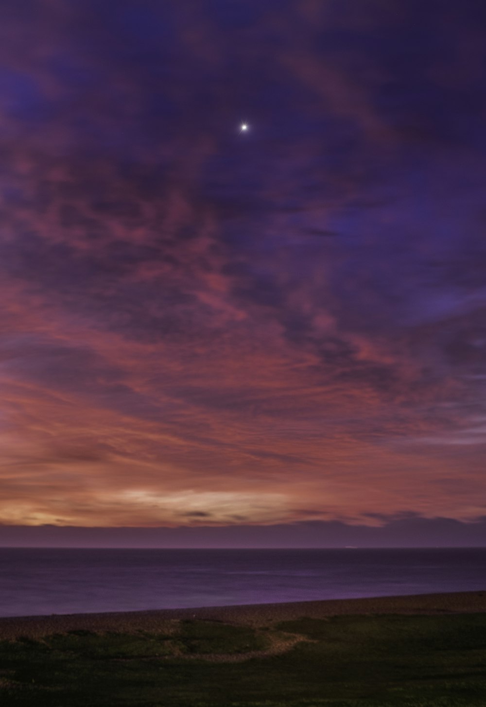 ocean under cloudy sky