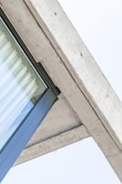 Architectural detail showing the blend of glass and concrete materials