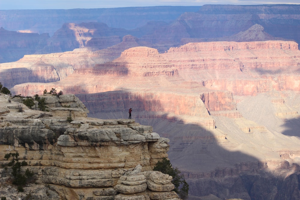 man standing on cliff