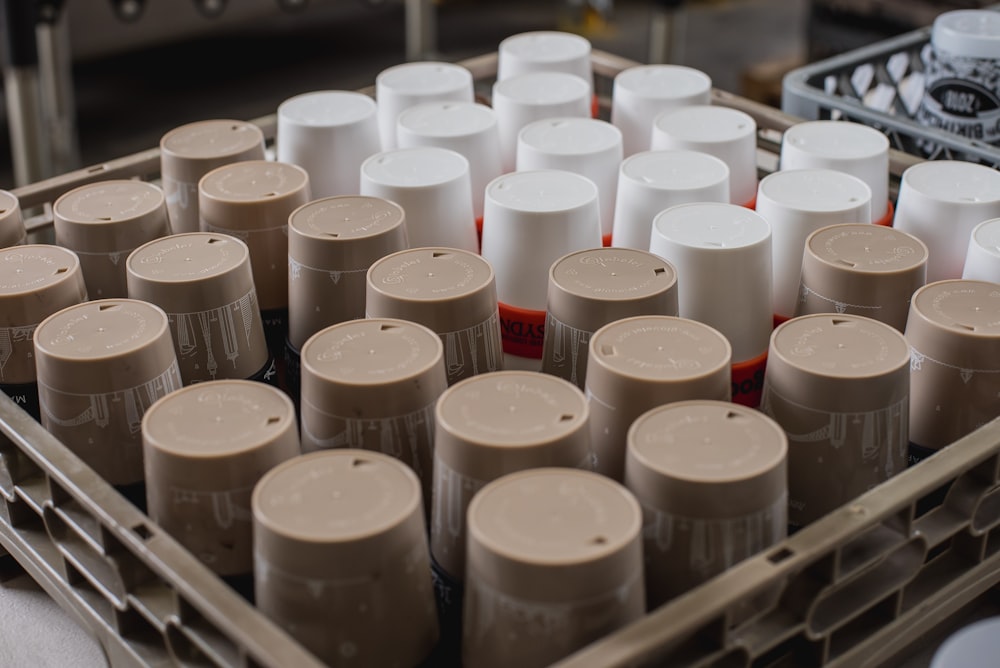 shallow focus photo of white and gray plastic containers