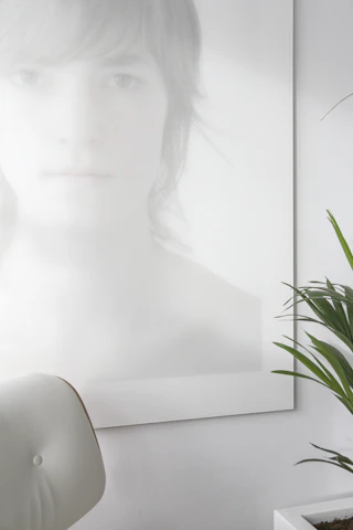 Professional portrait of Raimonda Čižauskaitė in a bright, minimalist setting with a white background.