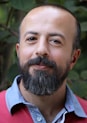 man wearing blue and red collared shirt
