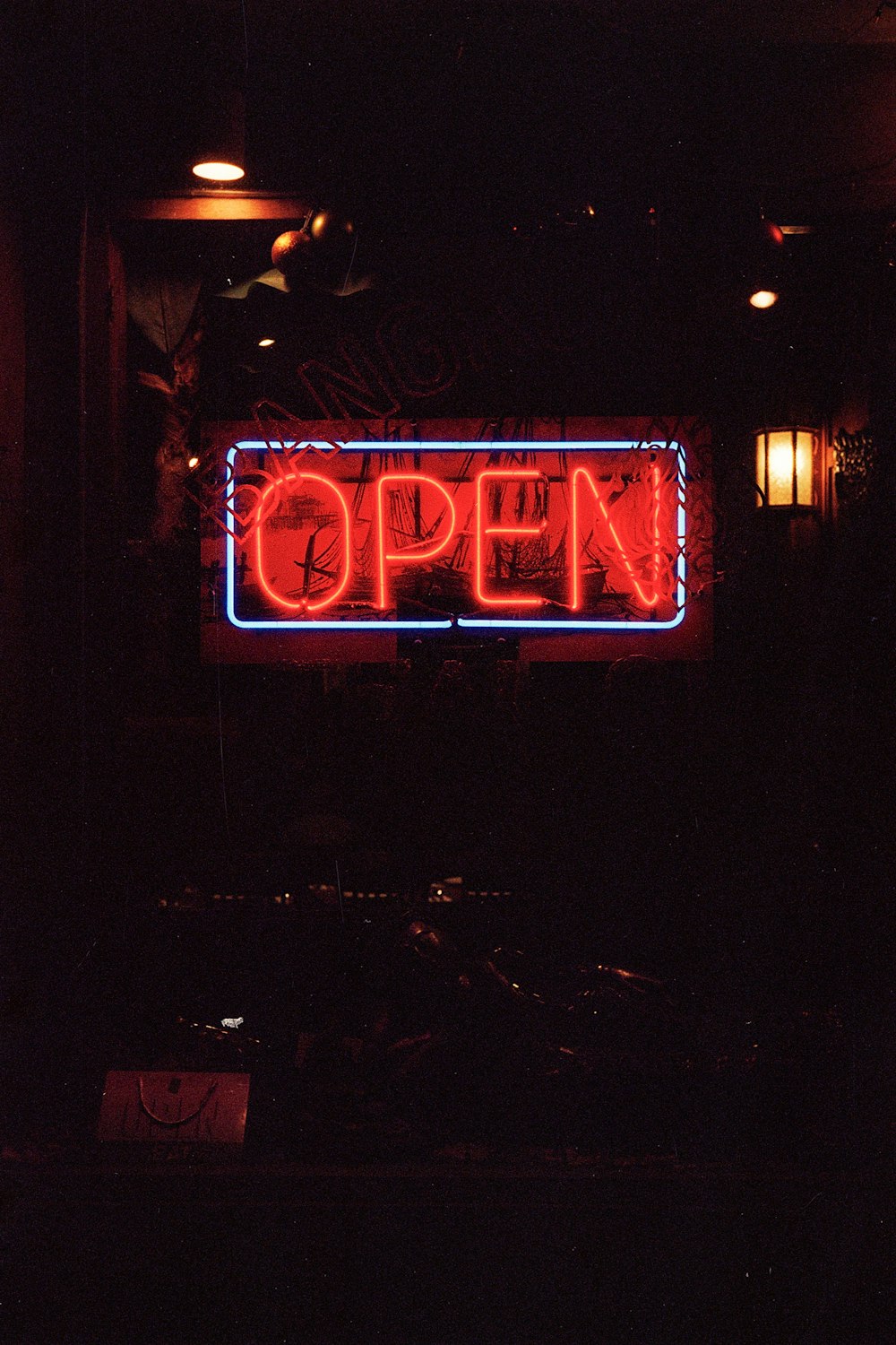 red open neon signage