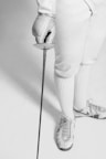 person holding fencing sword