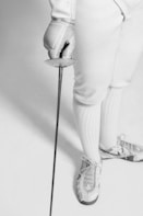 person holding fencing sword