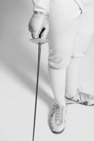 person holding fencing sword